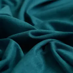 Tejido de punto azul verdoso, suave y fluido. Ideal para saber qué tejido es más fresco para el verano.