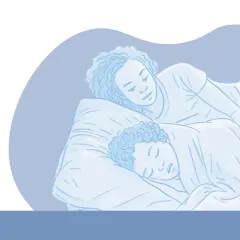 Una pareja duerme abrazada. Uno de ellos habla en sueños, diciendo "bla bla bla", quizás explicando por que se habla en sueños.
