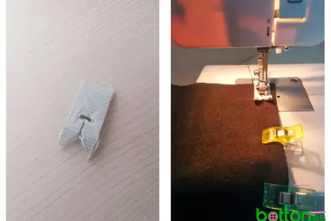 Máquina de coser trabajando sobre polipiel marrón, sujetada con clips.