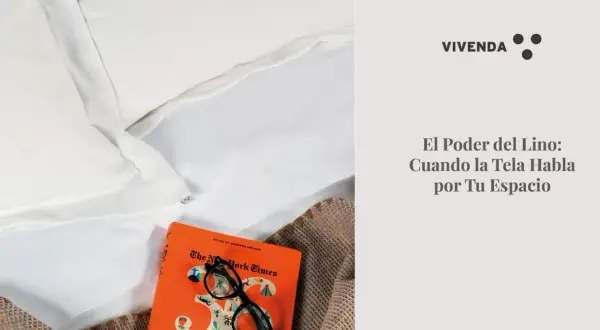 Suavidad y elegancia en blanco. El lino, protagonista de un espacio acogedor, junto a un libro y gafas.