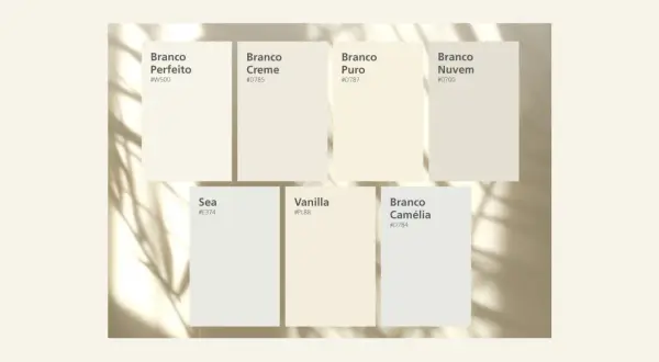 Muestras de pintura que ilustran la diferencia entre blanco y blanco roto, con nombres como "Branco Perfeito" y "Vanilla".