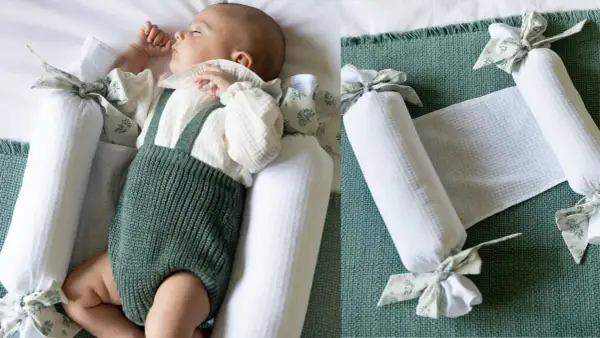 Bebé durmiendo plácidamente, rodeado de protectores para hacer colecho. Un nido seguro y acogedor.